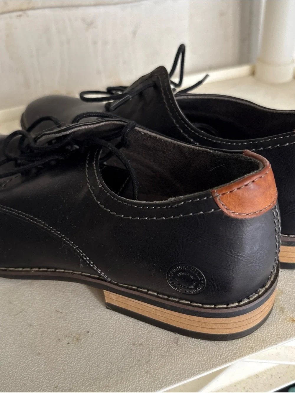 Steve Madden  Black Lace-Up Shoes with Brown Heel Accent